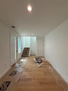 a large kitchen with stainless steel appliances a large counter top