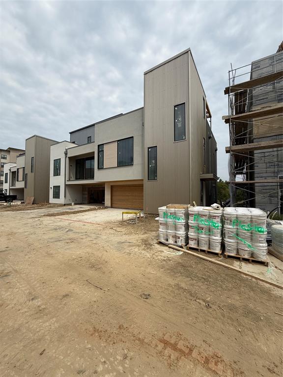 1111 Raiford Road, Unit 101 Carrollton, TX 75007 - Photo 22 of 26 a front view of a house with a garage