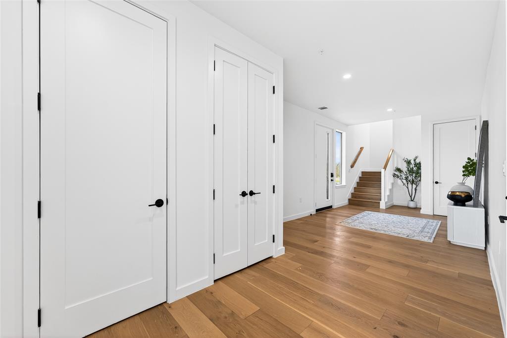 1111 Raiford Road, Unit 101 Carrollton, TX 75007 - Photo 5 of 31 a view of a hallway with wooden floor and entryway