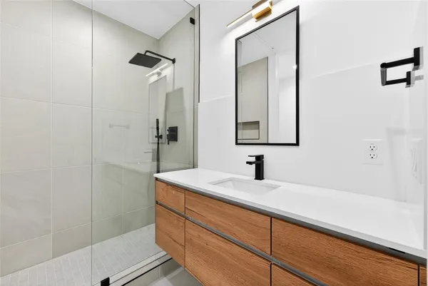 a bathroom with a sink and a mirror