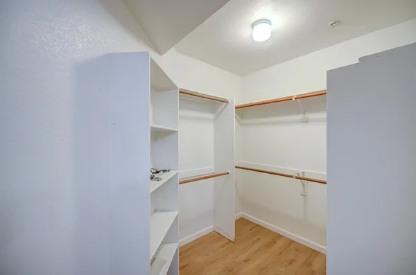 a white toilet sitting next to a bath tub
