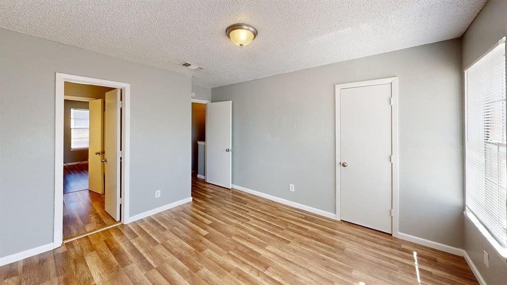 8108 Foxfire Lane, Unit B White Settlement, TX 76108 - Photo 4 of 12 a view of room with window and wooden floor
