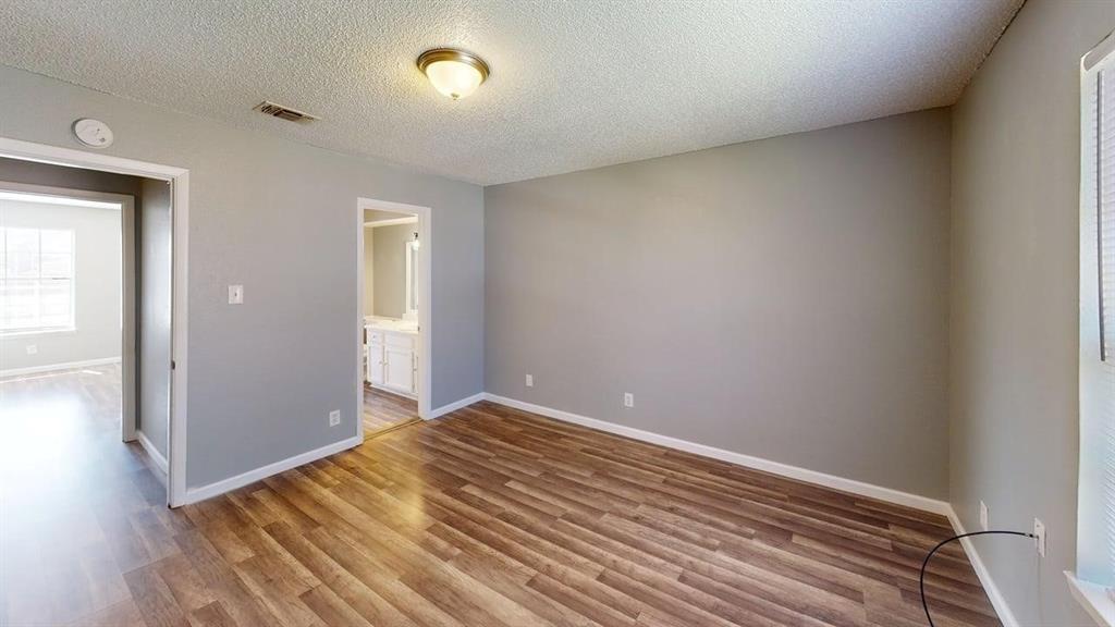 8108 Foxfire Lane, Unit B White Settlement, TX 76108 - Photo 5 of 12 a view of room with wooden floor