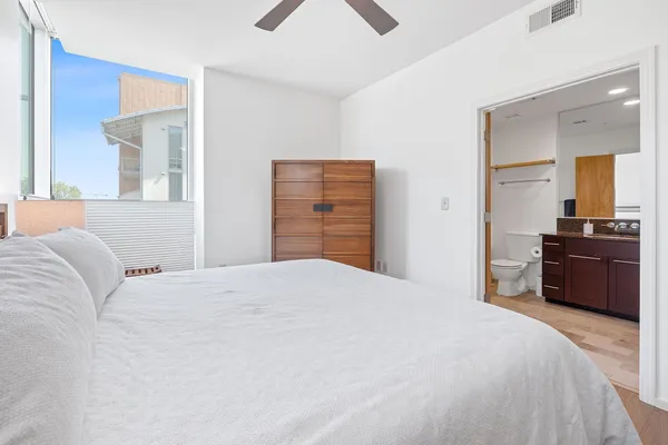 a bedroom with a bed and a television