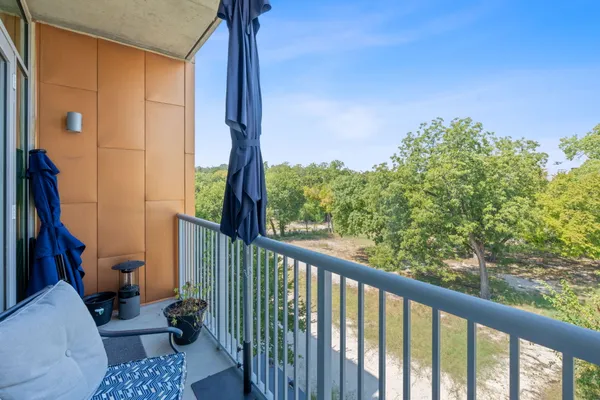 a view of balcony with furniture