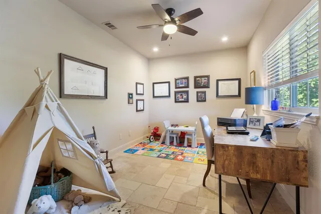 a workspace with furniture and window