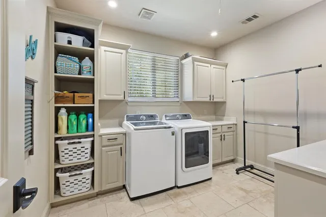 a kitchen with stainless steel appliances granite countertop a stove and a refrigerator