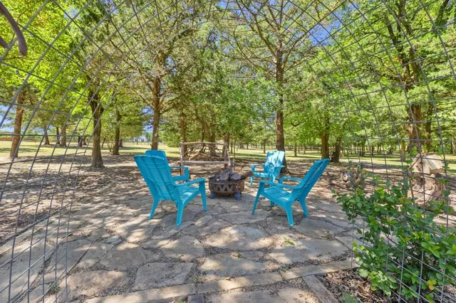 a view of a bench in a backyard