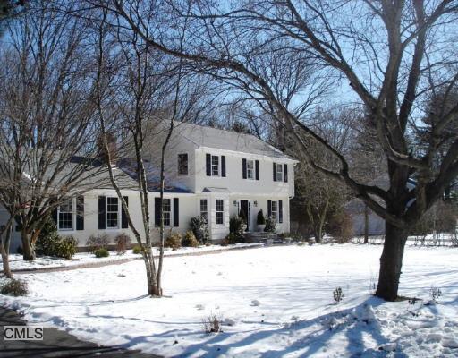 352 Mountain Laurel Road Fairfield, CT 06824 - Photo 1 of 1 a view of a white house with a large tree