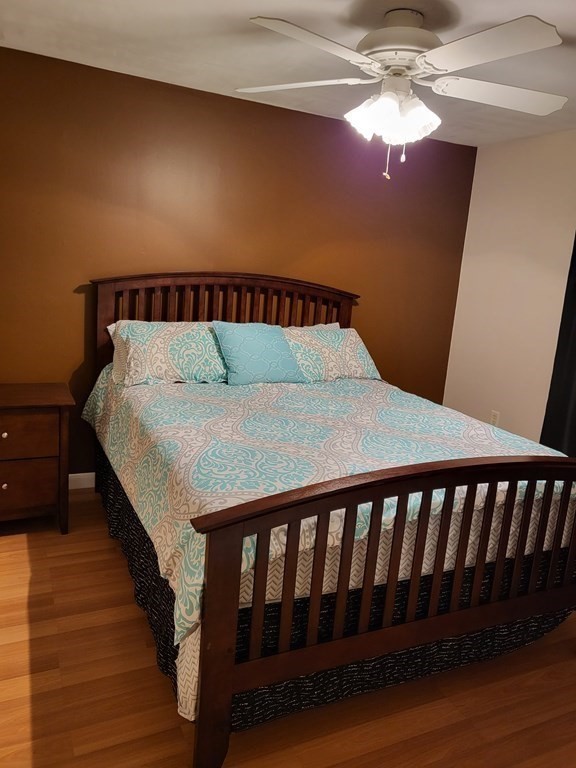 246 Lamont Street Springfield, MA 01119 - Photo 15 of 23 a bed sitting in a bedroom next to a lamp