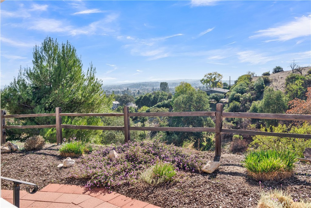 123 19th Street Paso Robles, CA 93446 - Photo 23 of 24 a view of a garden with a bench in a garden