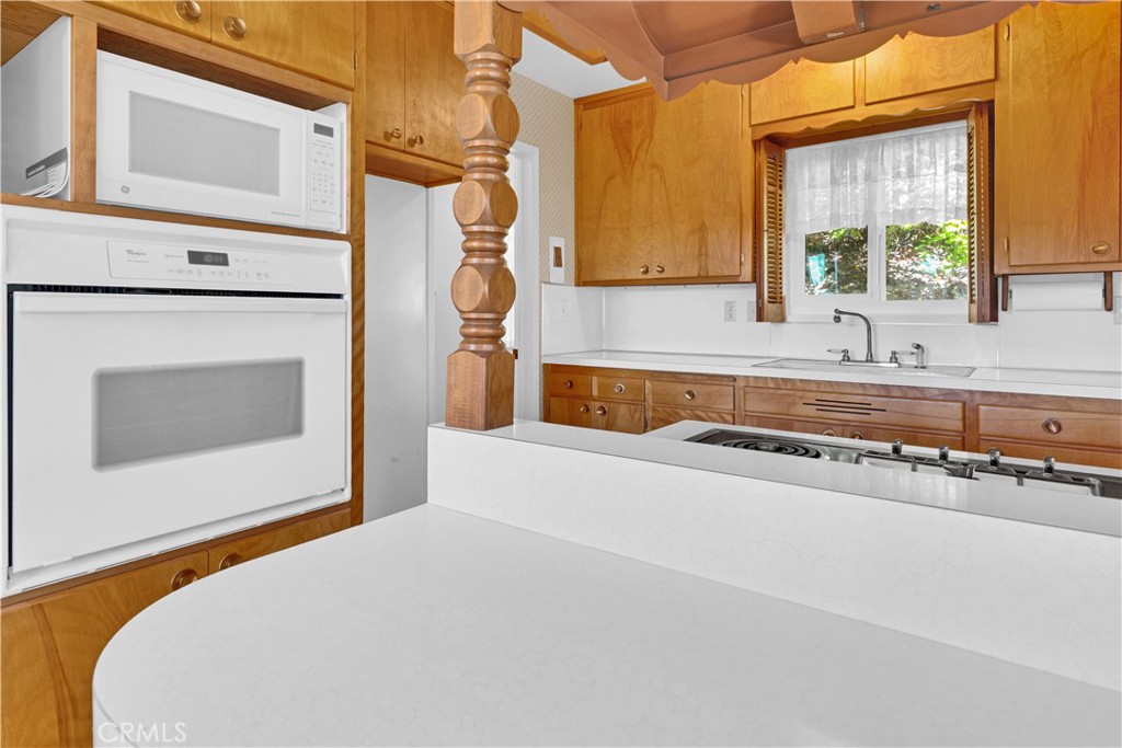 123 19th Street Paso Robles, CA 93446 - Photo 8 of 24 a bedroom with a bed dresser and a window