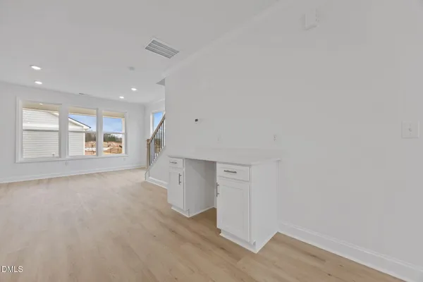 a view of a kitchen with a sink and a refrigerator