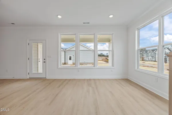 a view of a livingroom with a ceiling fan and window