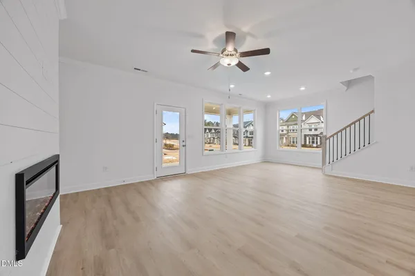 a view of an entryway with wooden floor