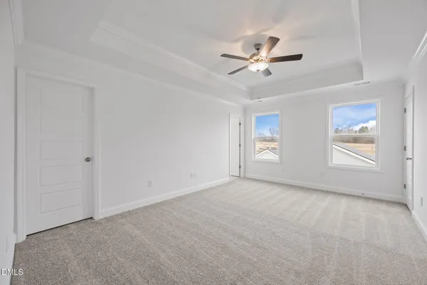 a view of an empty room and closet area
