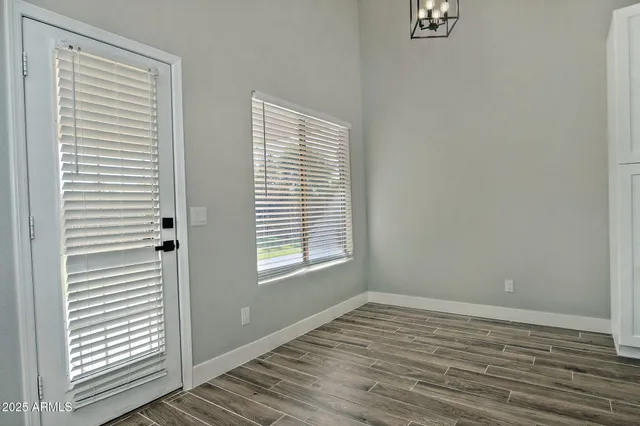 a kitchen with stainless steel appliances a refrigerator sink and microwave