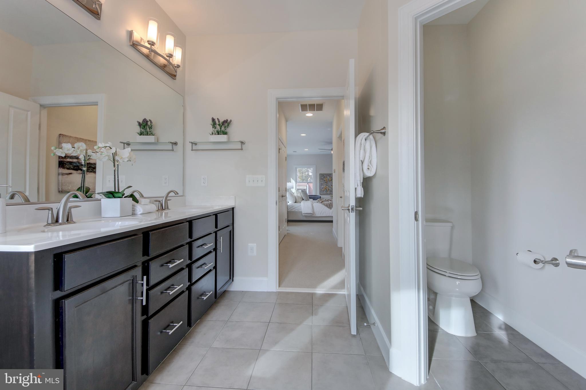 2002 Griffith Road Falls Church, VA 22043 - Photo 19 of 62 Primary bathroom with double sink and tile floors