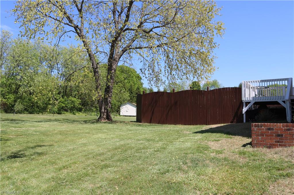 2629 Celeste Road Walkertown, NC 27051 - Photo 21 of 23 View of backyard towards the enclosed pool.