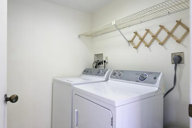 a kitchen with a sink and a refrigerator