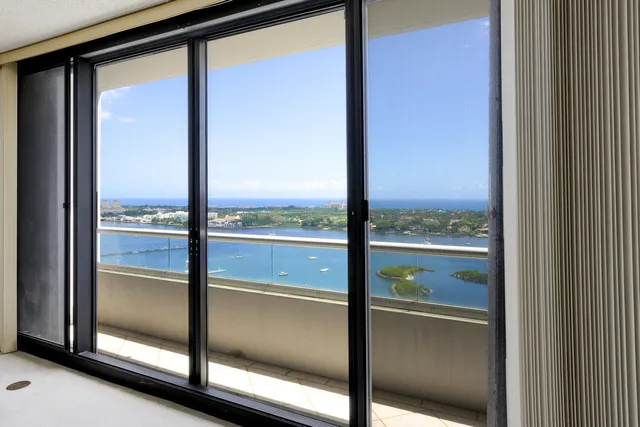 a kitchen with stainless steel appliances granite countertop a refrigerator sink and stove
