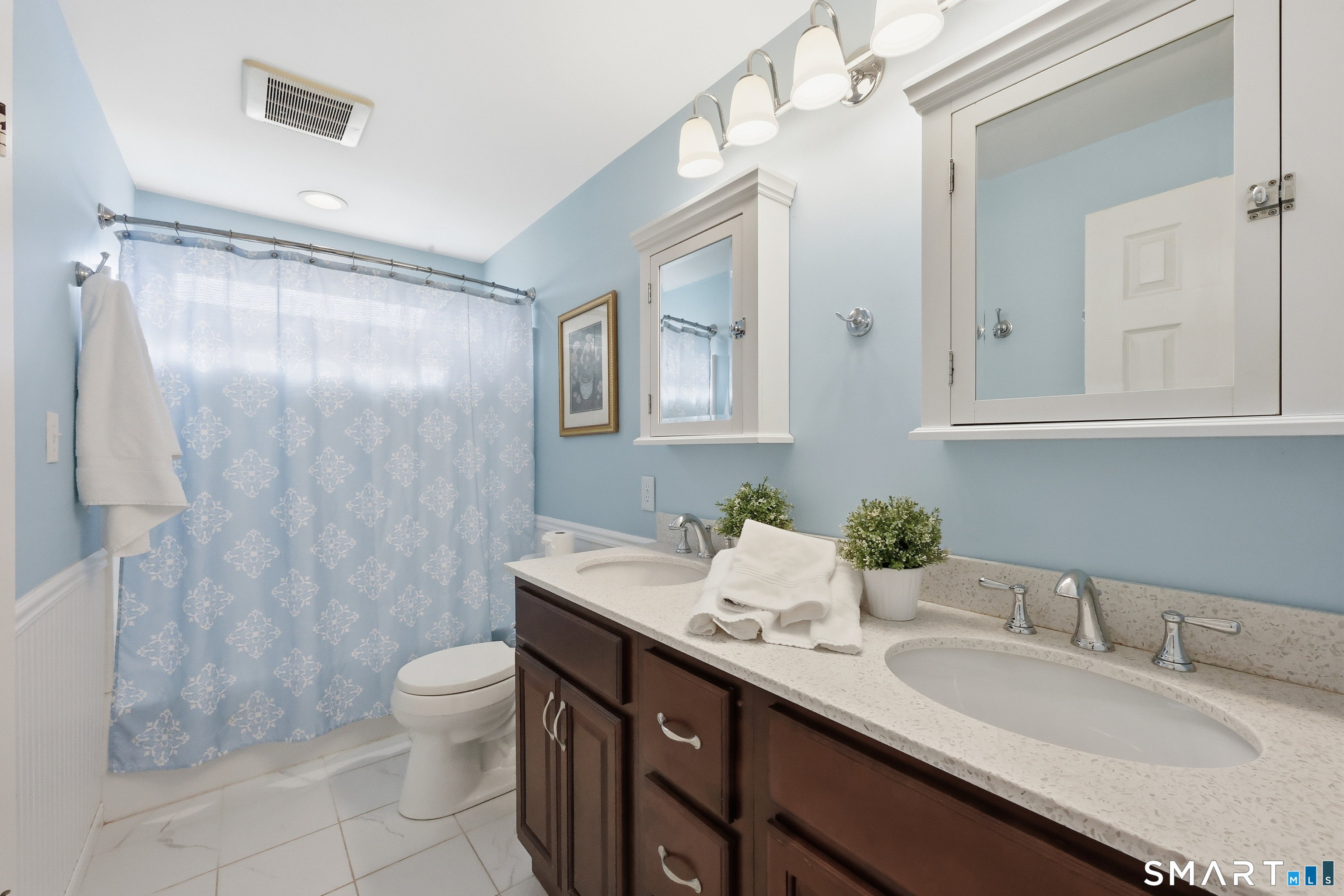 89 North Hoadley Street Naugatuck, CT 06770 - Photo 13 of 28 a bathroom with a granite countertop sink mirror vanity and toilet