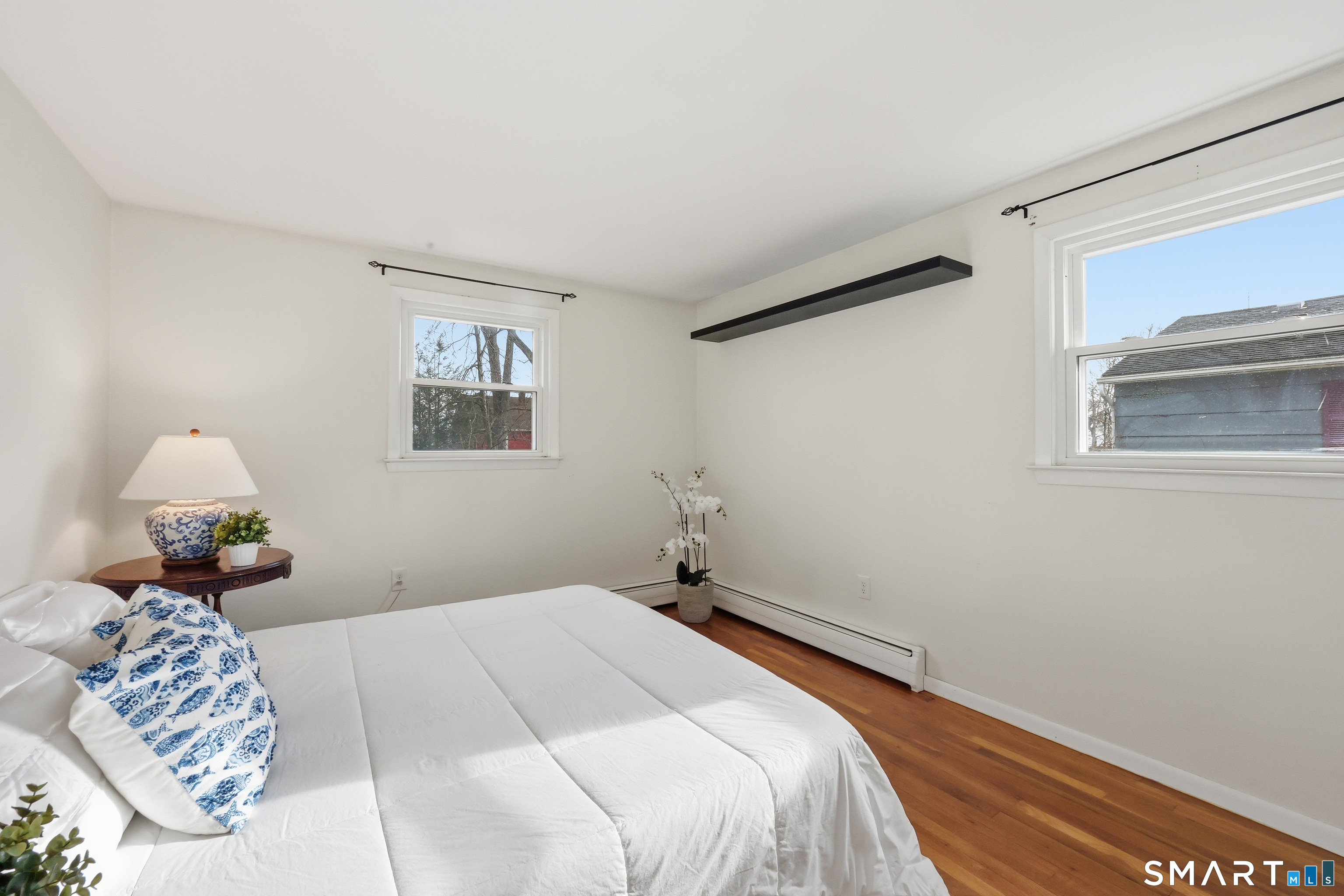 89 North Hoadley Street Naugatuck, CT 06770 - Photo 14 of 28 a bedroom with a bed and a painting on the wall