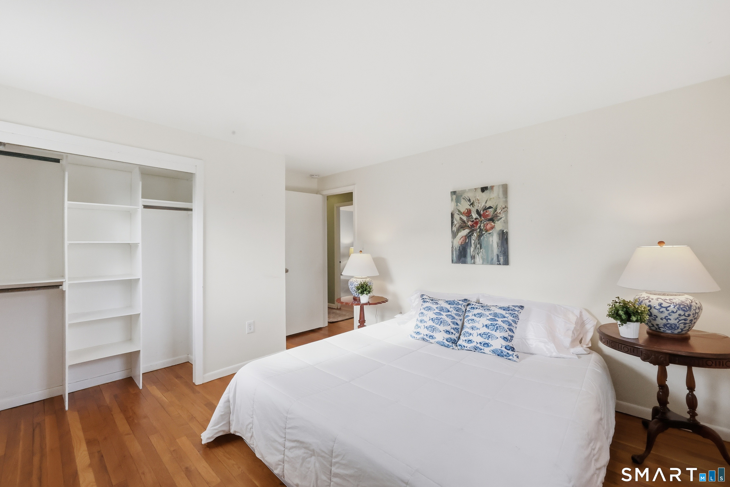 89 North Hoadley Street Naugatuck, CT 06770 - Photo 15 of 28 a bedroom with a bed and wooden floor