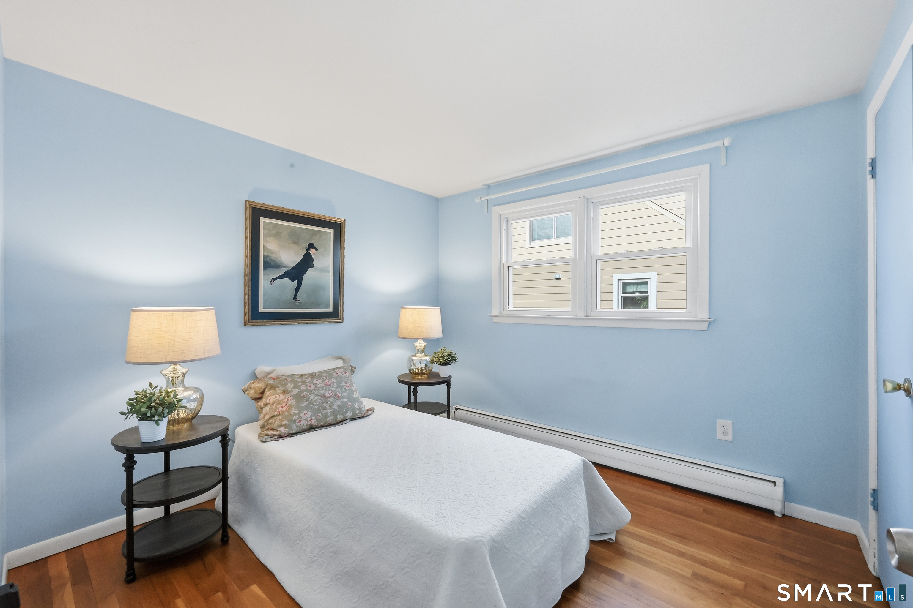 89 North Hoadley Street Naugatuck, CT 06770 - Photo 19 of 28 a bedroom with a bed and wooden floor