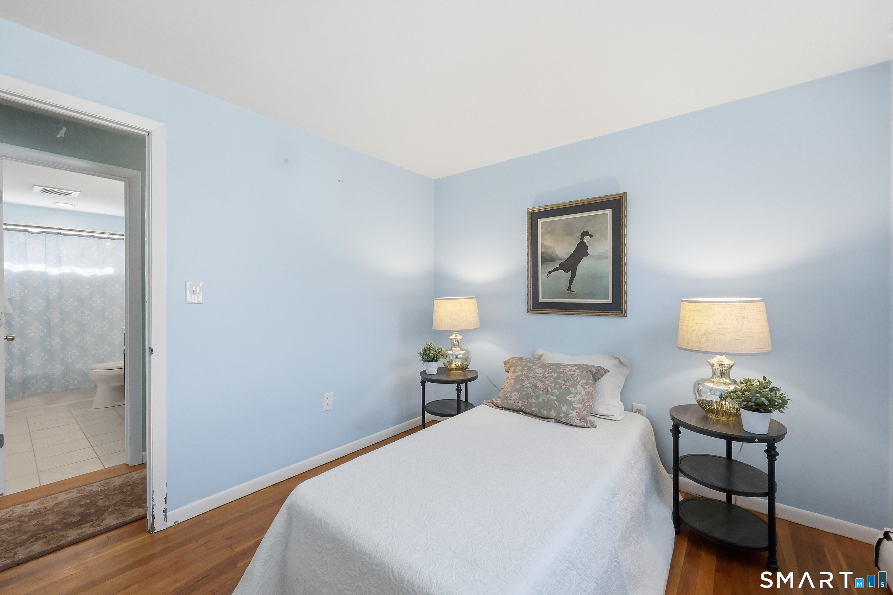 89 North Hoadley Street Naugatuck, CT 06770 - Photo 20 of 28 a bedroom with a bed and wooden floor