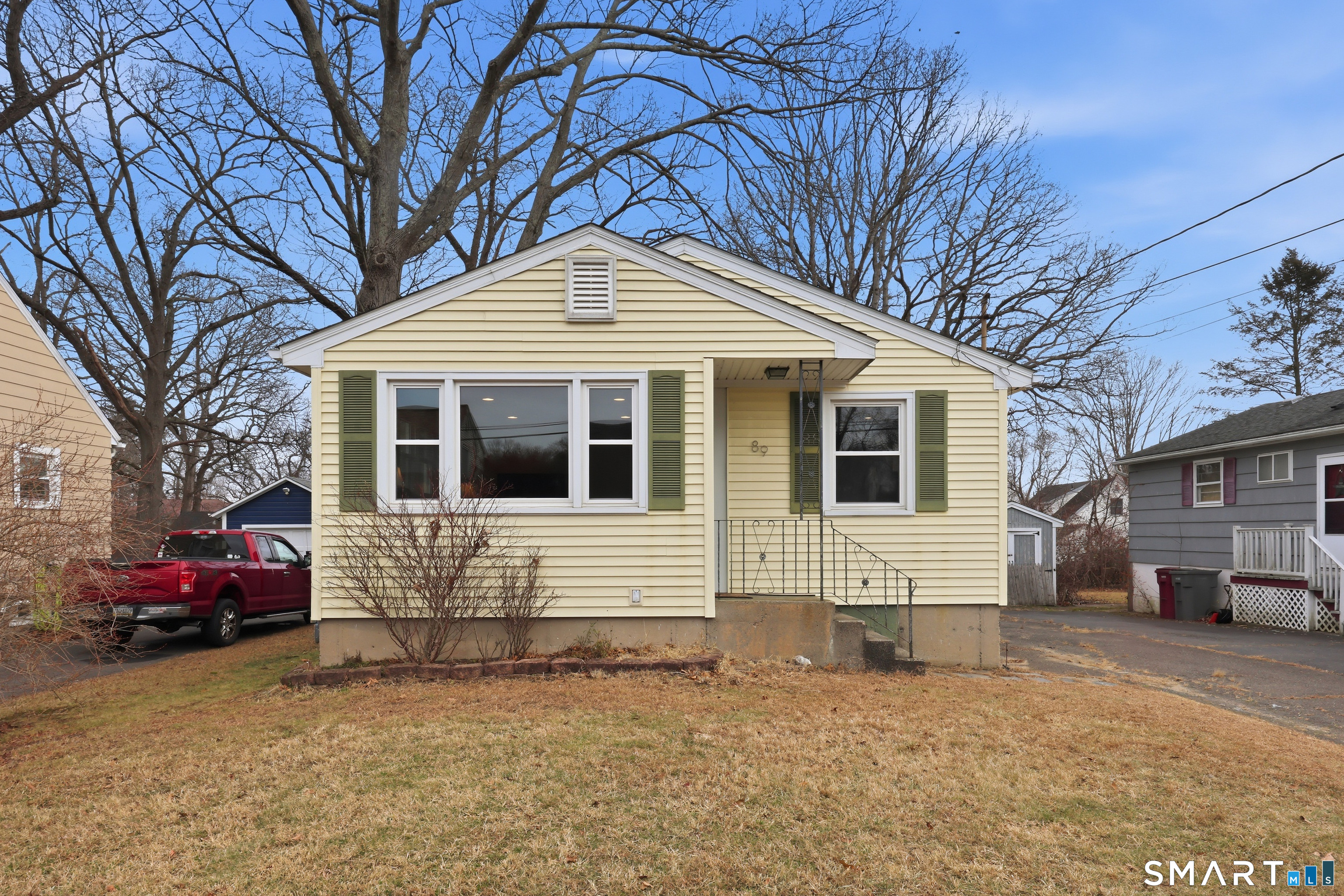 89 North Hoadley Street Naugatuck, CT 06770 - Photo 3 of 28 a front view of a house with a yard