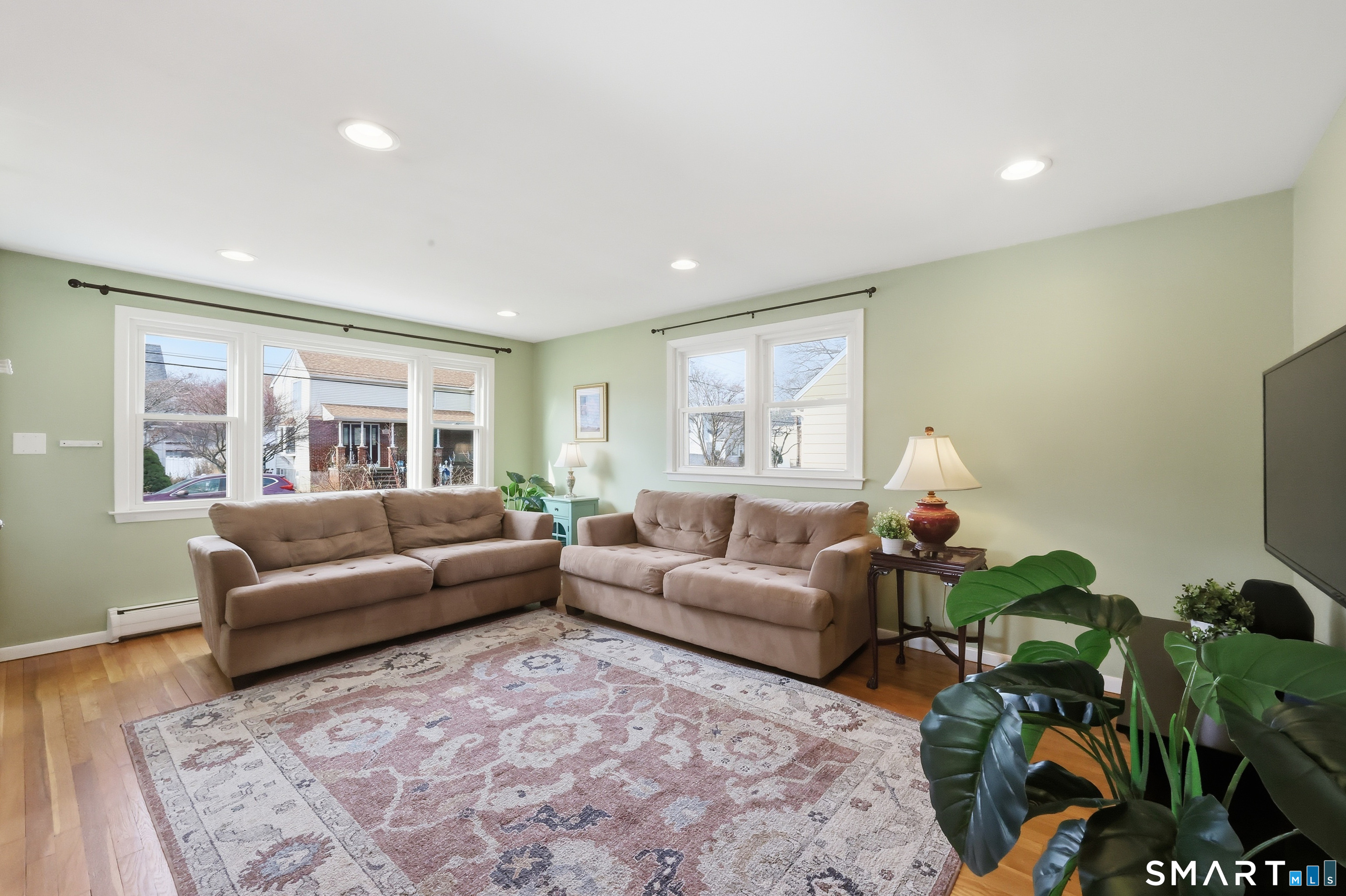 89 North Hoadley Street Naugatuck, CT 06770 - Photo 4 of 28 a living room with furniture and a flat screen tv