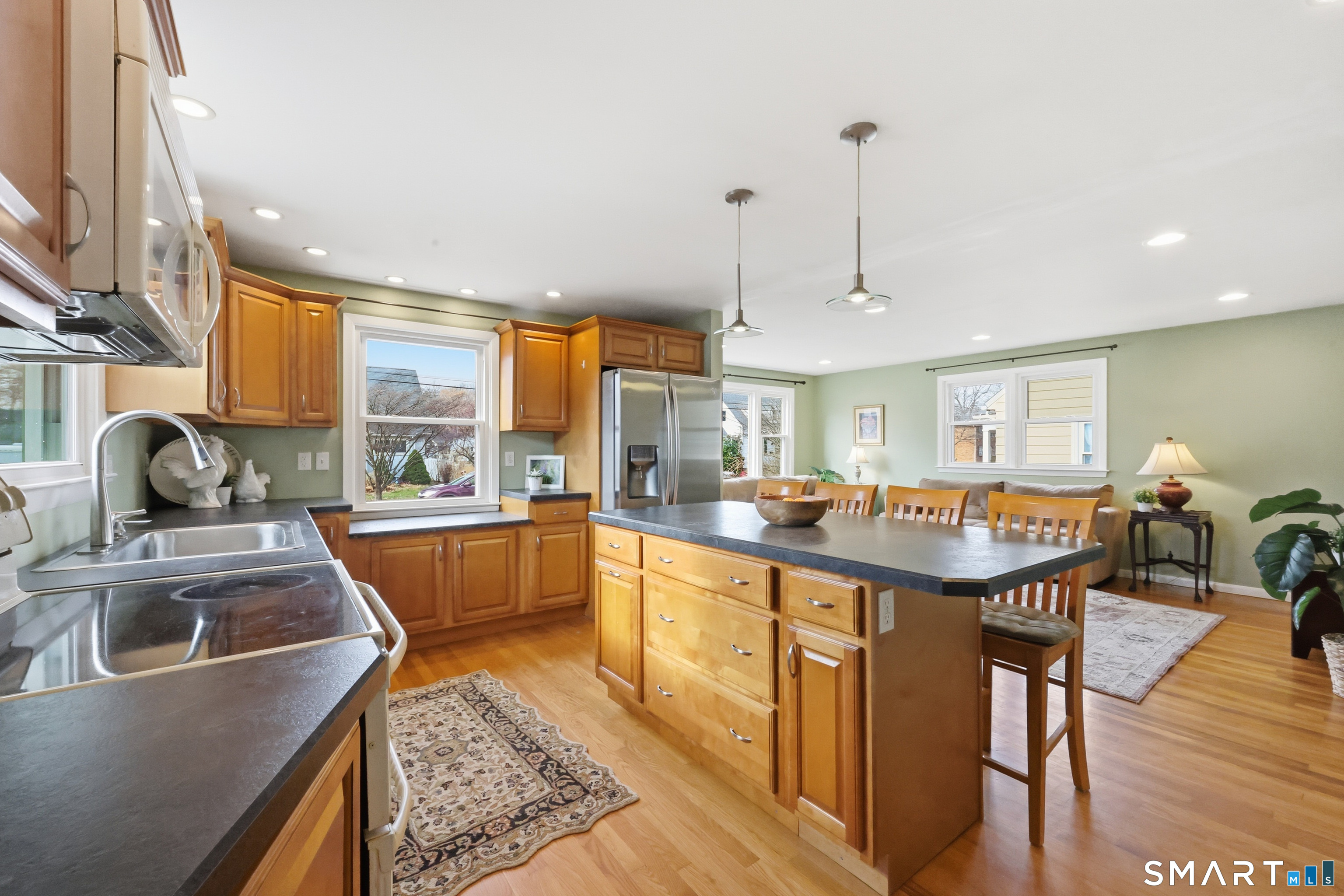 89 North Hoadley Street Naugatuck, CT 06770 - Photo 10 of 28 a kitchen with stainless steel appliances granite countertop a sink stove and wooden cabinets