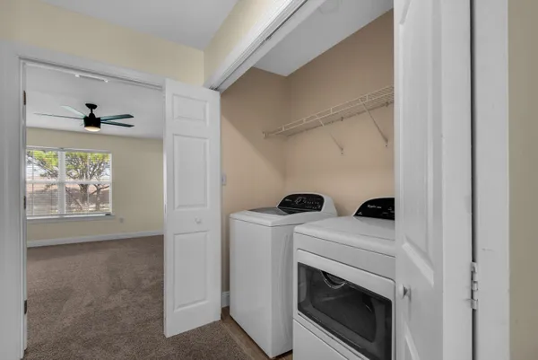 a view of room with window and ceiling fan