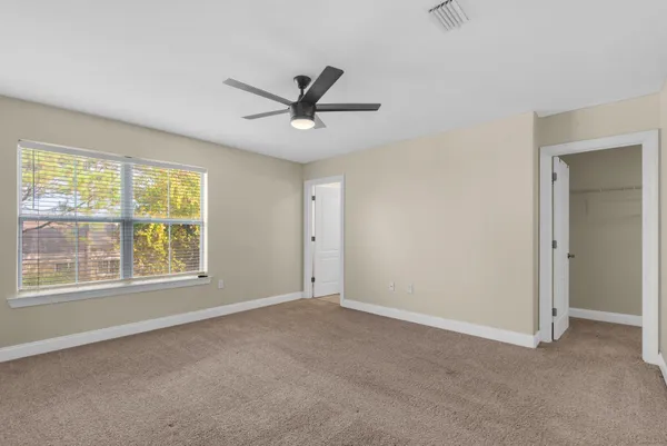a view of a livingroom with a ceiling fan and a ceiling fan