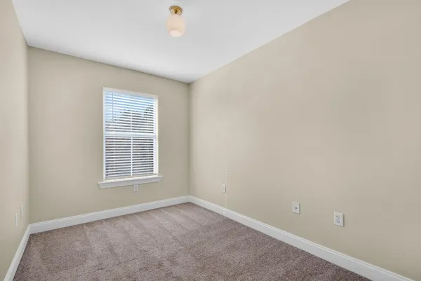 a view of a brick house with a large window
