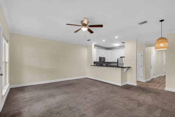 a kitchen with a sink stainless steel appliances and cabinets