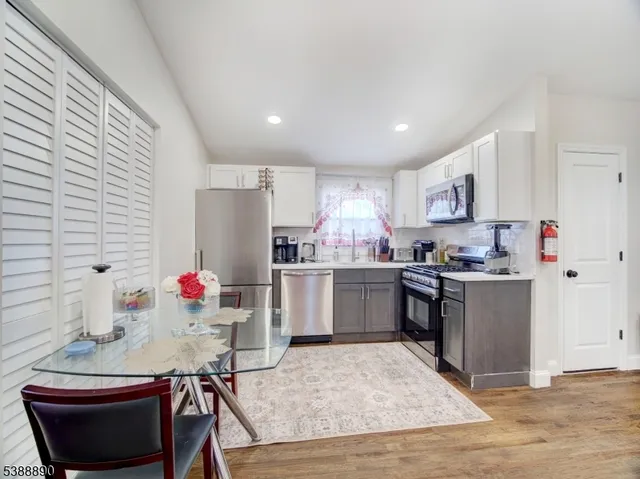 a kitchen with a sink cabinets and window