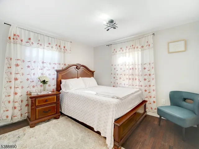 a bedroom with a bed and a chair