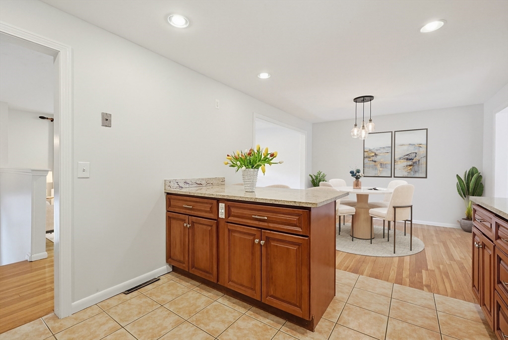 26 Beaver Brook Road Sharon, MA 02067 - Photo 11 of 42 a kitchen with stainless steel appliances kitchen island granite countertop a refrigerator and a sink