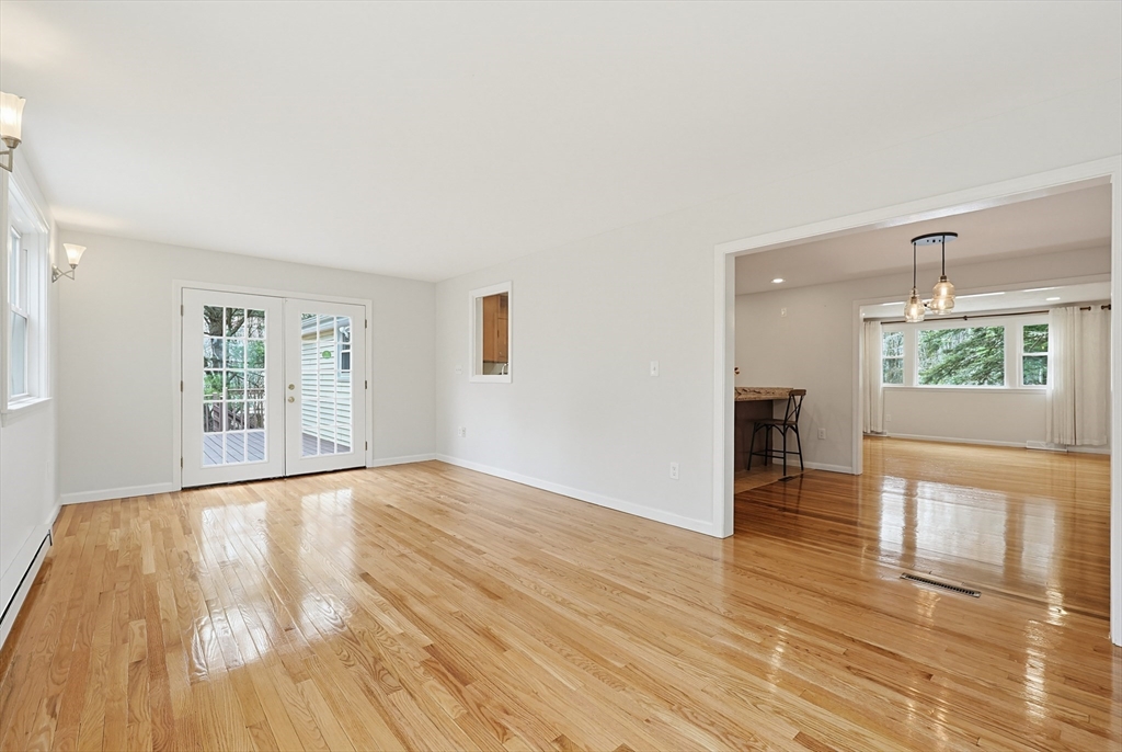 26 Beaver Brook Road Sharon, MA 02067 - Photo 16 of 42 a view of an empty room with wooden floor and a window