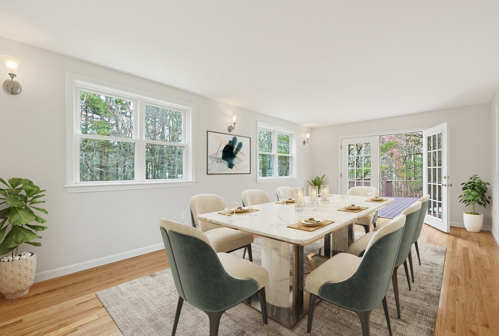 26 Beaver Brook Road Sharon, MA 02067 - Photo 17 of 42 a dining room with wooden floor a chandelier a glass table and chairs