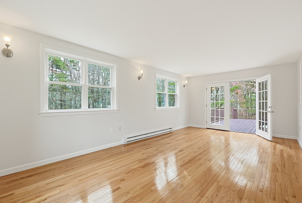 26 Beaver Brook Road Sharon, MA 02067 - Photo 18 of 42 a view of an empty room with wooden floor and a window