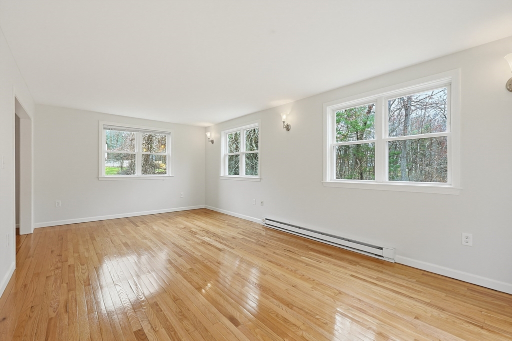 26 Beaver Brook Road Sharon, MA 02067 - Photo 20 of 42 a view of an empty room with wooden floor and a window