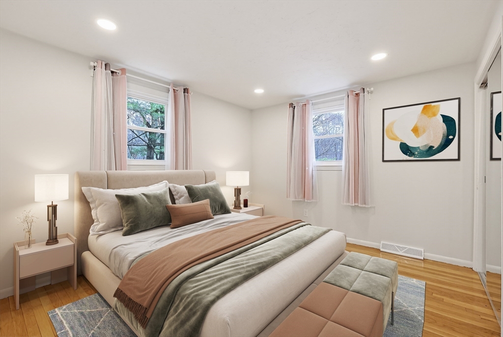 26 Beaver Brook Road Sharon, MA 02067 - Photo 24 of 42 a bedroom with a bed and a painting on the wall