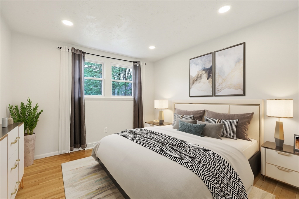26 Beaver Brook Road Sharon, MA 02067 - Photo 26 of 42 a bedroom with a large bed and a potted plant
