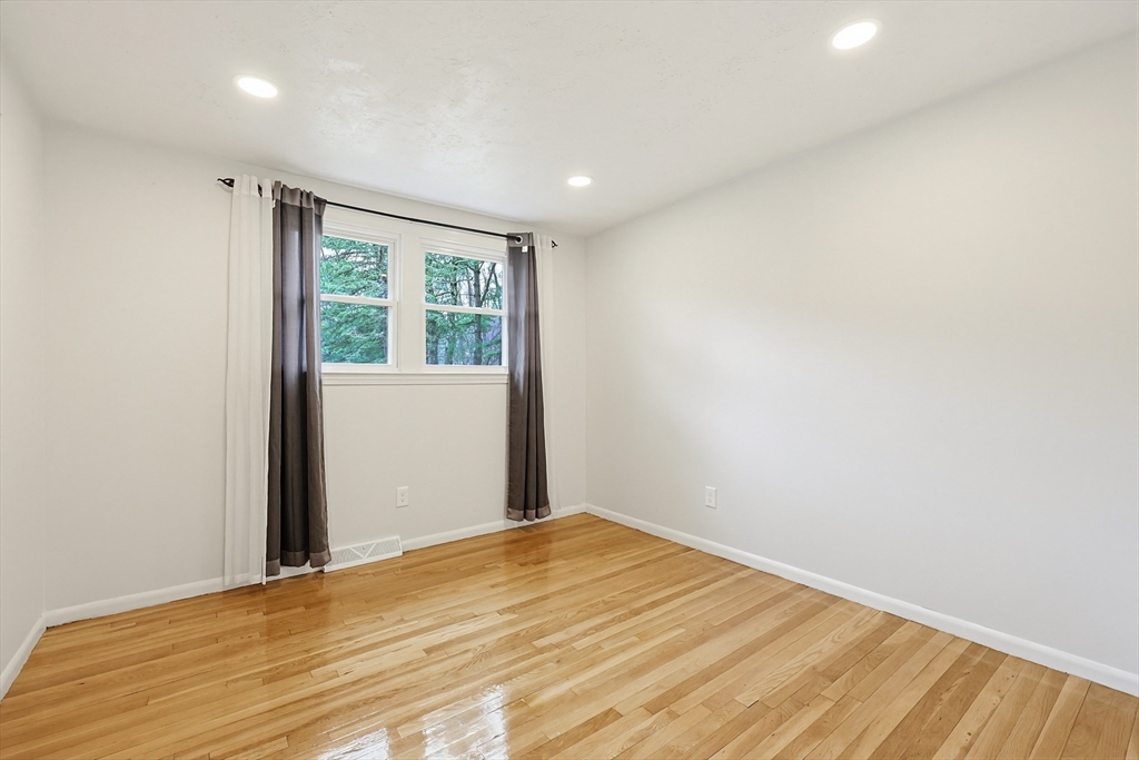 26 Beaver Brook Road Sharon, MA 02067 - Photo 27 of 42 a view of empty room with wooden floor and fan