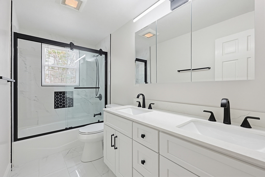 26 Beaver Brook Road Sharon, MA 02067 - Photo 28 of 42 a bathroom with a sink a toilet and shower