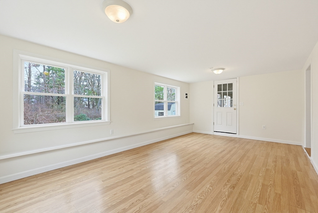 26 Beaver Brook Road Sharon, MA 02067 - Photo 36 of 42 an empty room with wooden floor and windows