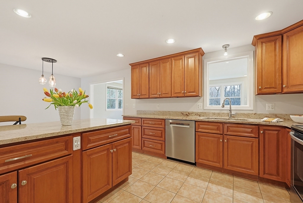 26 Beaver Brook Road Sharon, MA 02067 - Photo 7 of 42 a kitchen with stainless steel appliances granite countertop counter space a sink and cabinets